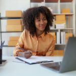 Beautiful Businesswoman start small business. A woman works from home delivering parcels online