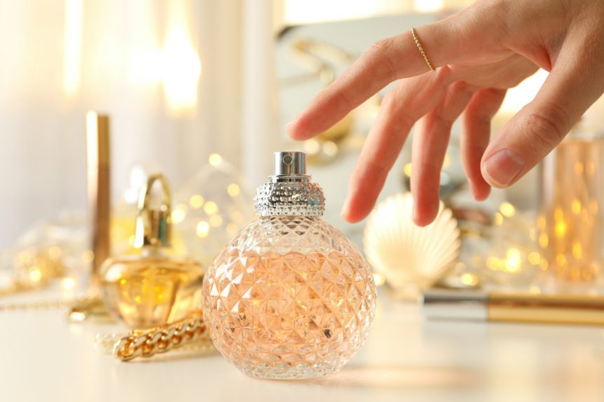 Bottles with perfume on a white table